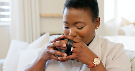Image showing Black woman, coffee and relax watching tv on sofa drinking espresso in living room home. Tea, happy smile and female from Nigeria streaming movie or online video on television and spending time alone
