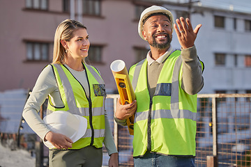 Image showing Architect, construction site and employees with success, conversation and planning for new project. Engineer, man and woman with hard hat, outdoor and discussion for deadline, schedule and building