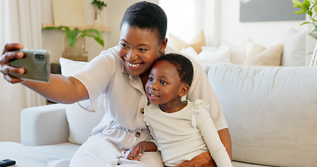 Image showing Smartphone, selfie and mother with child on living room sofa for social media post, parents blog update or family home celebration. Black family smile in cellphone portrait photography for online app