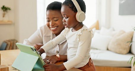 Image showing Tablet, black mother and girl on video call, being happy and wave with smile in living room at home. Mama, child and daughter with digital device for connect, smile and bonding to blow kiss in lounge