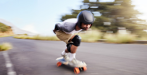Image showing Skateboard, fast and mountain with man in road for speed, freedom and summer break. Sports, adventure and motion blur with guy skating in urban street for training, gen z and balance in nature