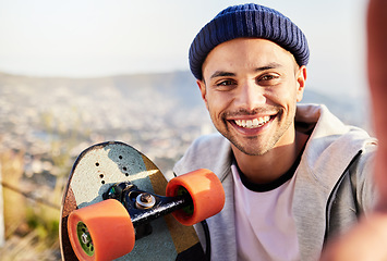 Image showing Portrait, selfie and view with a skater man in nature, taking a picture while outdoor for a skate. Summer, skateboard or photograph with a happy male outside in the mountains for recreation skating
