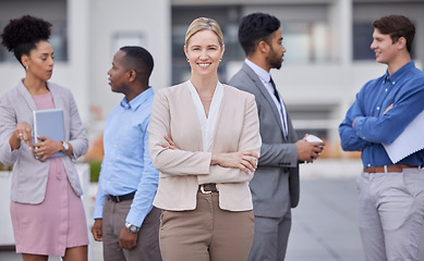 Image showing Business people, leadership and portrait of woman outside office with smile and confidence on break from work. Manager, ceo and lady boss with employees networking and b2b with human resources team.