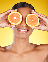 Image showing Skincare, beauty and portrait of Indian woman with orange and facial detox with smile on yellow background. Health, wellness and model face with organic luxurycleaning and grooming cosmetics.