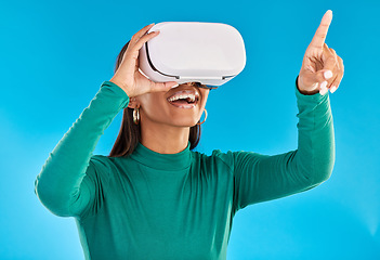 Image showing Woman with VR headset, metaverse and futuristic technology with simulation and gaming on blue background. Virtual reality, hand touch digital screen and video game, user experience and cyber space