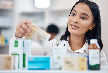 Image showing Client, pharmacy and woman with pills, medicine and in store for health, thinking and retail. Medical, female customer and lady with bottles, purchase and shopping for wellness, treatment and product