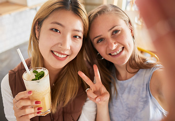 Image showing Selfie, portrait or friends take profile picture in cafe with happy smile on holiday vacation or weekend. Social media, Asian or young women smiling in restaurant for fun brunch date with cocktails