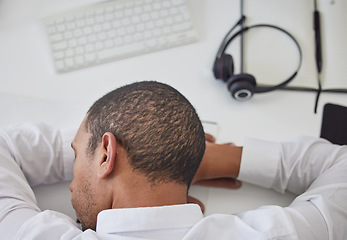 Image showing Burnout, call center or tired black man sleeping at desk from overworked by deadlines or stress. Customer support, consultant or lazy telemarketing employee at computer exhausted, fatigue or resting