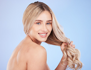 Image showing Hair care, beauty and face portrait of woman in studio isolated on a blue background. Cosmetics, keratin and happy young female model with salon treatment for hairstyle, blonde balayage and growth.