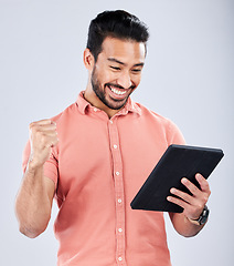 Image showing Happy asian man, tablet or success fist on isolated studio background for financial growth, stock market deal or future security. Smile, cheering or trader with winner hands, technology or loan app