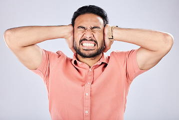 Image showing Psychosis, mental health and angry Asian man with bipolar isolated on a grey studio background. Stress, fear and scared guy closing ears for noise, frustration and suffering with rage on a backdrop