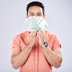 Image showing Asian man, portrait or money fan on studio background for financial freedom, stock market profit or investment. Winner, cash or euro for happy investor for finance success, savings or isolated growth