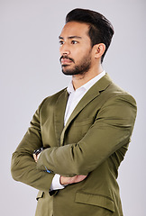 Image showing Business, serious and Asian man arms crossed, leadership and concentration with guy against a grey studio background. Male entrepreneur, employee and manager with thoughts, thinking and future ideas