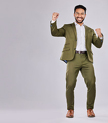 Image showing Business man, portrait and happy about win, champion and success, cheers on studio background. Yes, fist pump and mockup space with young male, professional achievement and promotion, bonus or reward