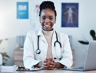 Image showing Black woman, doctor in portrait and healthcare, smile in office and laptop, medical professional and happy in career. Female physician, hands and health mindset with cardiologist at clinic and leader