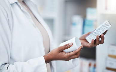 Image showing Hands, pharmacy and choice with box, medicine and decision with prescription for healthcare. Pharmacist, black woman and pharmaceutical pills for health, wellness or medical store with stock on shelf