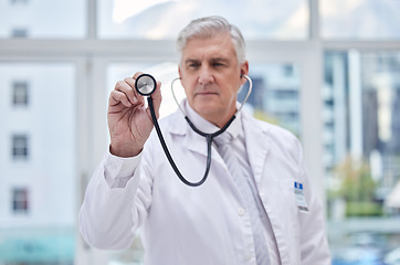 Image showing Doctor, stethoscope or listening man in hospital trust, healthcare wellness or life insurance support. Mature, medical or cardiology equipment for clinic worker, surgery expert or lungs professional