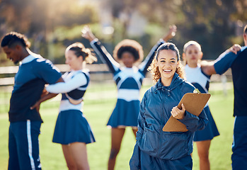 Image showing Cheerleader team, woman portrait and training coach with clipboard for practice, sports management and competition. Happy black woman or cheerleading checklist for coaching group of people outdoor