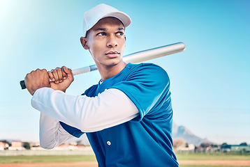 Image showing Sports, baseball and serious man with bat on field ready to hit ball in game, practice and competition. Fitness, motivation and male athlete outdoors for exercise, training and workout for match