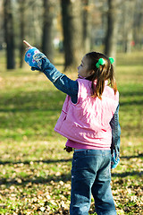 Image showing child looking up in the park
