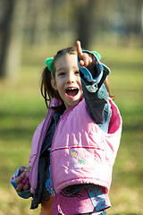 Image showing child looking up in the park