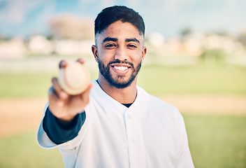 Image showing Baseball player, portrait and sportsman holding ball on match or game day on a sports field or pitch feeling happy. Sport, athlete and pitcher at training with a smile due to health and wellness