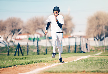 Image showing Baseball, sports and fitness run of a sport player on a green outdoor field in a team game. Training, workout and exercise of a young athlete with happiness and freedom from runner speed in the sun