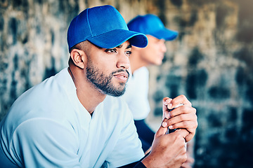 Image showing Baseball player, stadium dugout and sport training focus of a athlete looking at game. Summer sports, teamwork and workout of a person with softball group at professional event for outdoor exercise