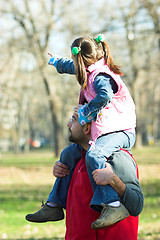 Image showing child on father shoulder in the park