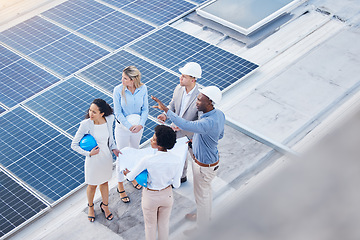 Image showing Solar energy, teamwork or engineering team on roof by future electricity technology innovation together. Collaboration, top or black man talking or planning a grid sustainability project with people