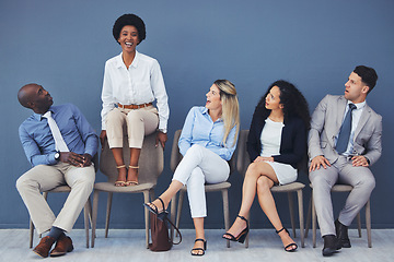 Image showing Business people, hiring and waiting room of woman standing out against wall for interview, meeting or opportunity. Group of diverse interns looking at African American female candidate in recruitment