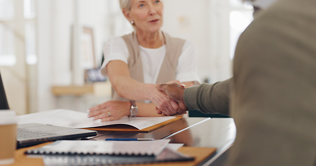 Image showing Elderly business people, handshake and b2b for partnership, trust or deal agreement at the office table. Senior woman and man shaking hands for business meeting, interview or welcome at the workplace