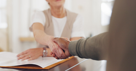 Image showing Elderly business people, handshake and b2b for partnership, trust or deal agreement at the office table. Senior woman and man shaking hands for business meeting, interview or welcome at the workplace