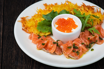 Image showing potato pancakes salmon fish and red caviar