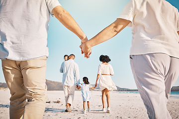 Image showing Holding hands, beach family and people walk, bond or enjoy quality time together for vacation, holiday peace or freedom. Sea water, ocean love and back view of couple travel on Sydney Australia sand