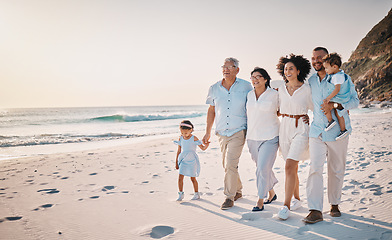 Image showing Family, grandparents and children walking on beach for holiday, vacation and bonding on weekend trip. Travel mockup, summer and kids holding hands with mom and dad for adventure, sunset and relax