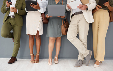 Image showing Office, row of legs and business people with technology for networking, internet and job application. Recruitment, hiring line and workers with tablet, laptop and phone for interview opportunity