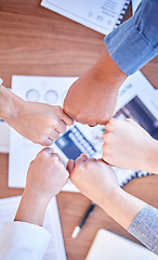 Image showing Fist bump, solidarity and above of business people hands for motivation, partnership and support. Meeting, teamwork and employees with fists for unity, collaboration and team building at a seminar