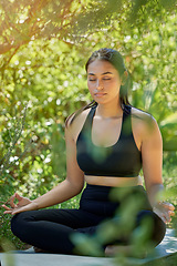 Image showing Lotus pose, yoga and woman in nature for wellness, peace or exercise on forest floor. Zen, meditation and girl relax in mental health, zen or training, chakra or balance cardio workout in countryside