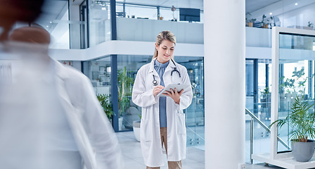 Image showing Busy, woman and doctor with tablet, lobby and connection for research, online reading and healthcare. Medical professional, female employee and lady with device, telehealth and touchscreen in clinic