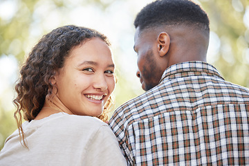 Image showing Portrait, love and a couple in the park together for a romantic date for their anniversary celebration during summer. Face, spring and romance with an attractive young female dating her boyfriend