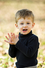 Image showing boy clapping