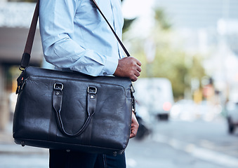 Image showing Business man, city and walking with bag, leather briefcase and accessory for travel, work and professional career. Closeup worker carry luggage in street, sidewalk and commute with corporate fashion