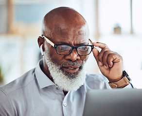 Image showing Confused black man, glasses or reading laptop in corporate office of finance budget crisis, taxes audit problem or financial loss. Mature CEO, doubt or businessman with technology or investment fail