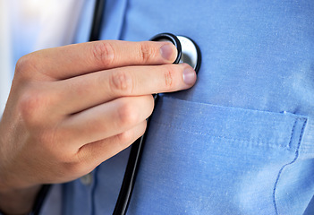 Image showing Heart, healthcare and stethoscope with a doctor in the hospital, testing his equipment before a consultation. Medical, hand and pulse with a medicine professional listening during a clinic checkup