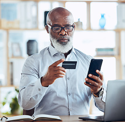 Image showing Black man, credit card or phone for finance management, insurance policy or investment payment in corporate office. Serious, mature or CEO businessman on bank app, mobile technology or online fintech