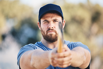 Image showing Target, focus and axe throwing with man in nature and aim for sports, training and tomahawk skills. Exercise, goal and hunting with athlete and hatchet in range for bullseye, ready and competition