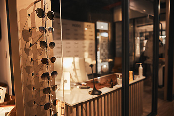 Image showing Sunglasses, fashion and retail with eyewear in an empty store after closing after hour for the night. Sale, display and product with a variety of glasses in a mall for shopping or consumerism