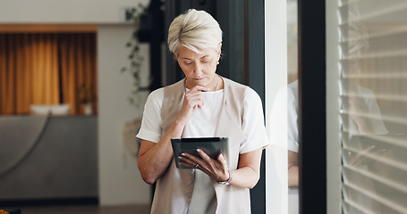 Image showing Senior business woman, tablet planning and window in office of online strategy ideas, innovation or data analytics. Female manager thinking with digital technology, website research or app management