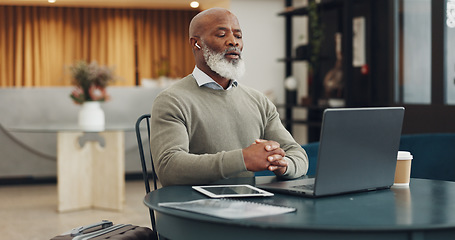 Image showing Earphones, laptop and black man on video call in office, online meeting or video conference. Webinar, mature and.businessman talking on computer in virtual meeting, workshop or interview video